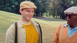 Nicholaus Hoult and Samuel L. Jackson in golfing attire in The Banker