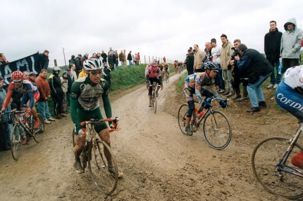 Robert Hayles struggles in the mud during the 2002 edition, the year Johan Museeuw claimed his final Roubaix title.