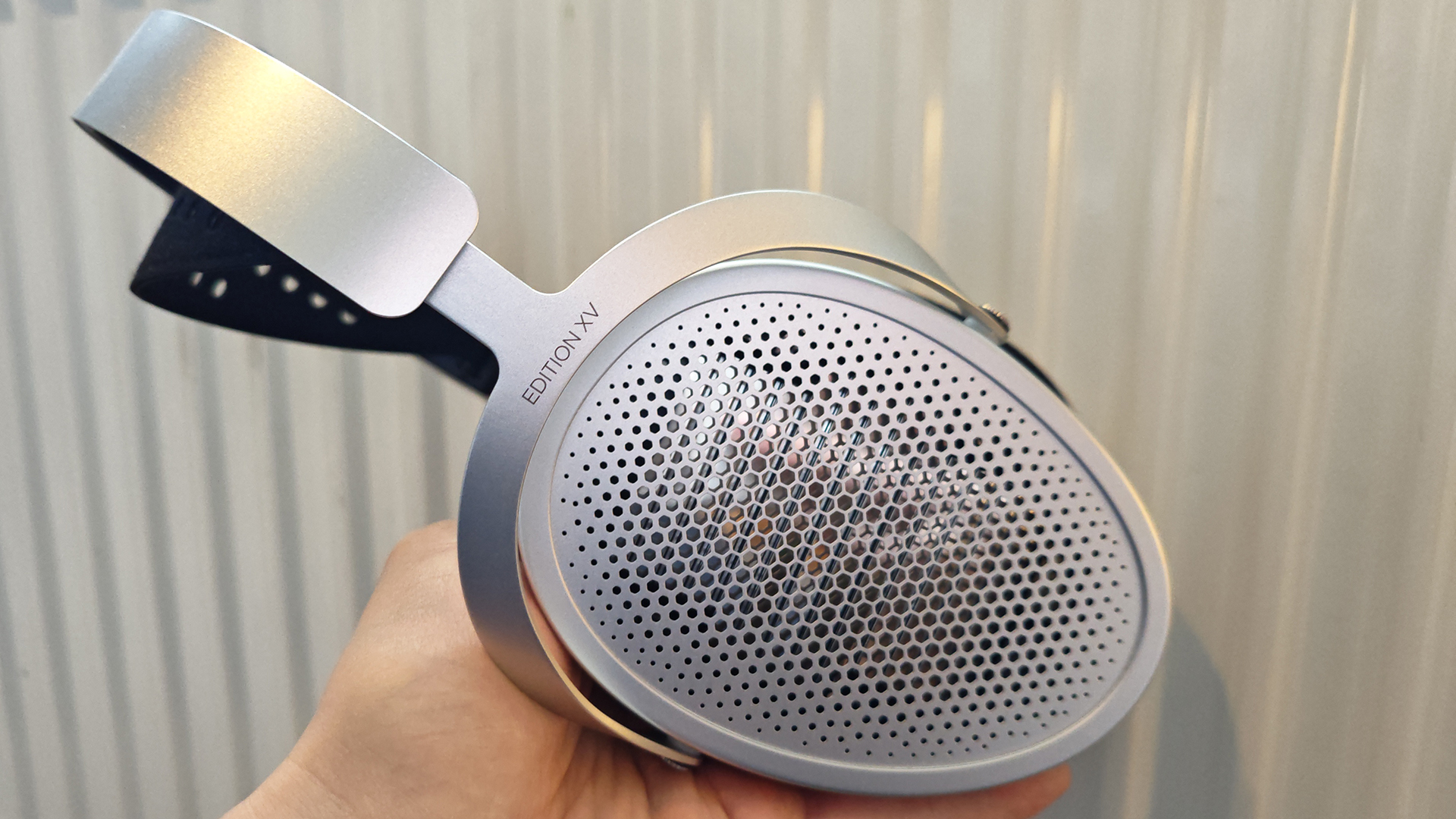 Various photos of the HiFiMan Edition XV headphone on a desktop table.