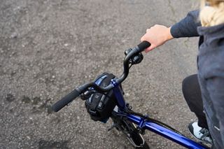 Detail of handlebars on a Brompton 12-speed Electric P-Line folding bike