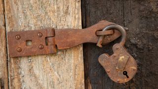 Open rusty padlock