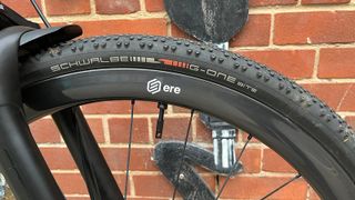 Close up of bike wheel with wall behind