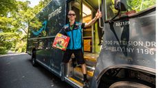 Amazon delivery man Joseph Sammarco of Mastic Beach, New York, aka "The Mystery Milk Bone Guy" delivering packages and Milk Bone dog treats for the homeowners who have dogs, on July 30, 2021 in Sound Beach, New York