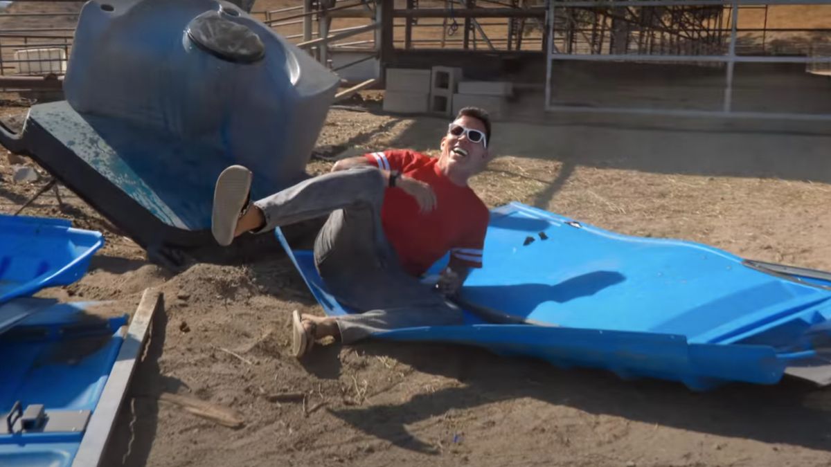 Steve-O laughing in the wreckage of an exploding toilet in Jackass Forever.