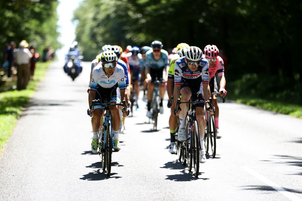 GRAND COLOMBIER FRANCE JULY 14 LR Nelson Oliveira of Portugal and Movistar Team and Kasper Asgreen of Denmark and Team Soudal Quick Step compete in the breakaway during the stage thirteen of the 110th Tour de France 2023 a 1378km stage from ChtillonSurChalaronne to Grand Colombier 1501m UCIWT on July 14 2023 in Grand Colombier France Photo by Michael SteeleGetty Images