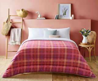 Night Lark Spring Gingham Coverless Duvet against a pink wall.