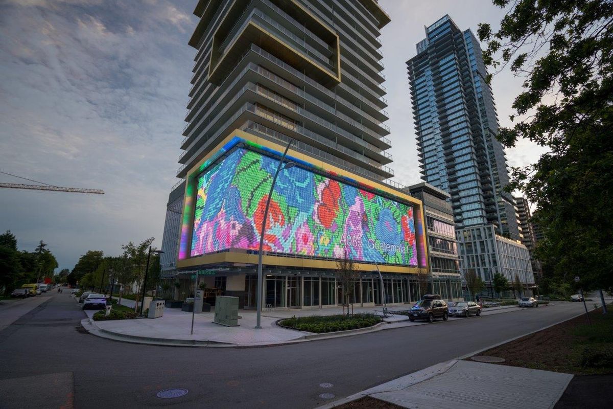 Outdoor LED mesh display transforms building into North America’s largest digital art canvas with Planar displays.