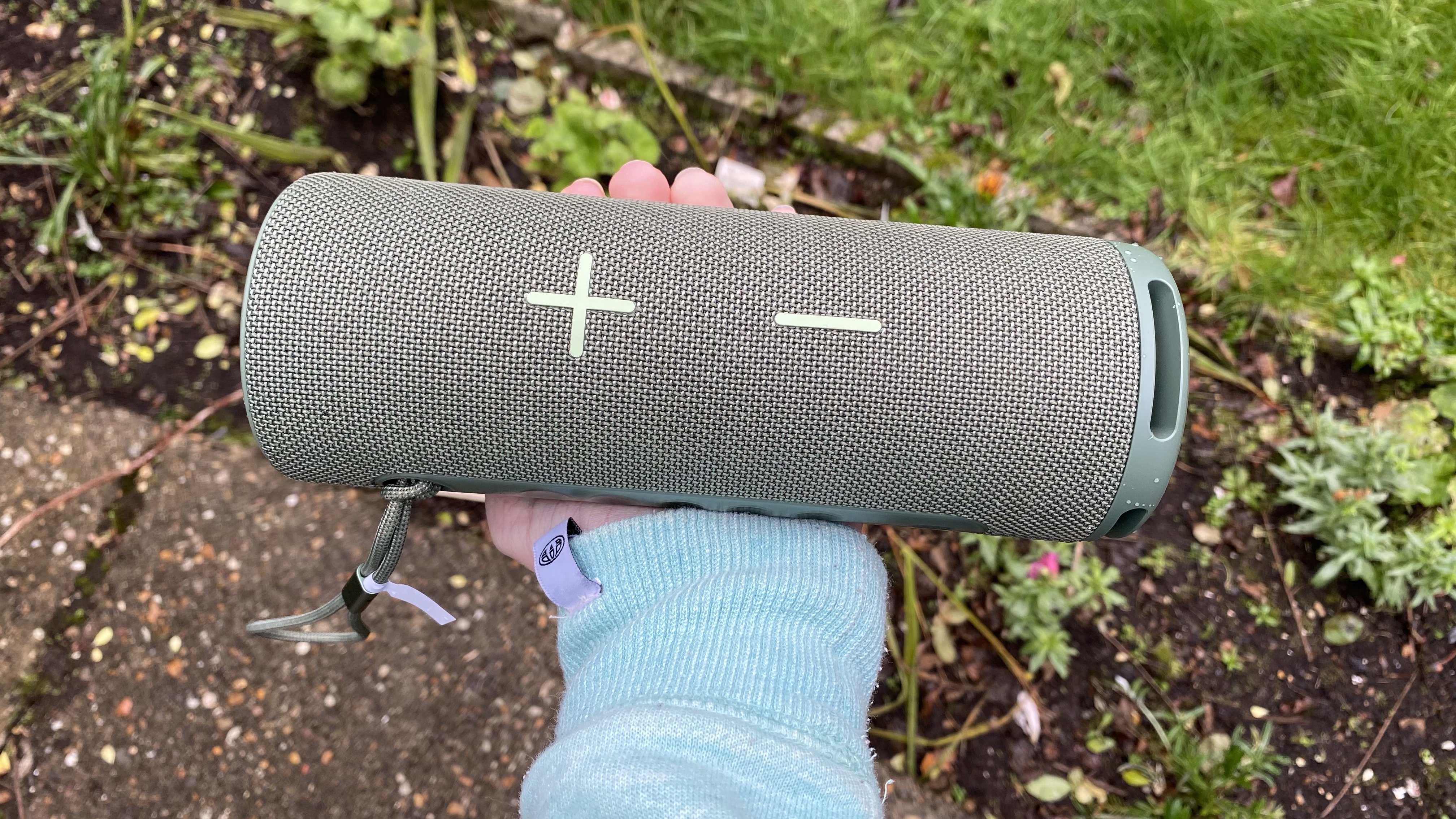 a person holding the huawei sound joy speaker horizontally