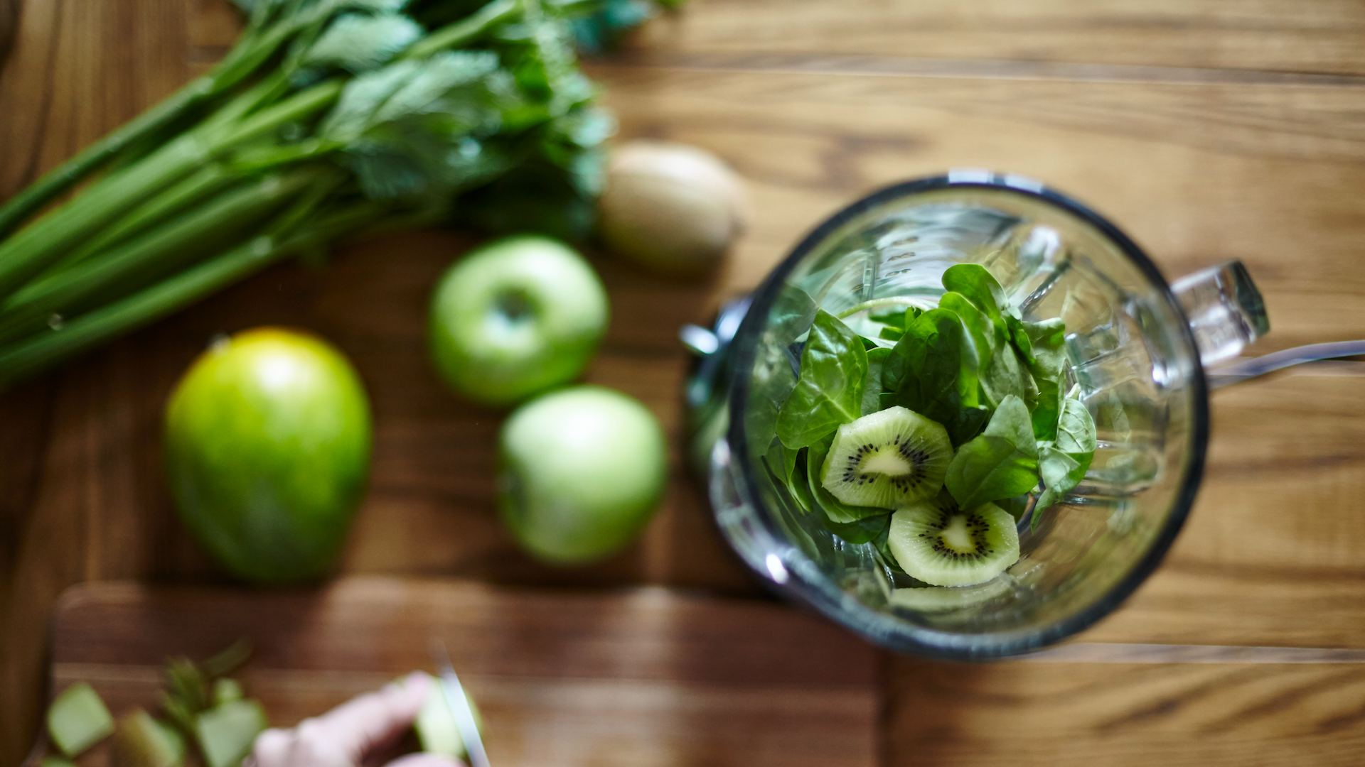 Fruit and vegetables being prepared to go in a blender
