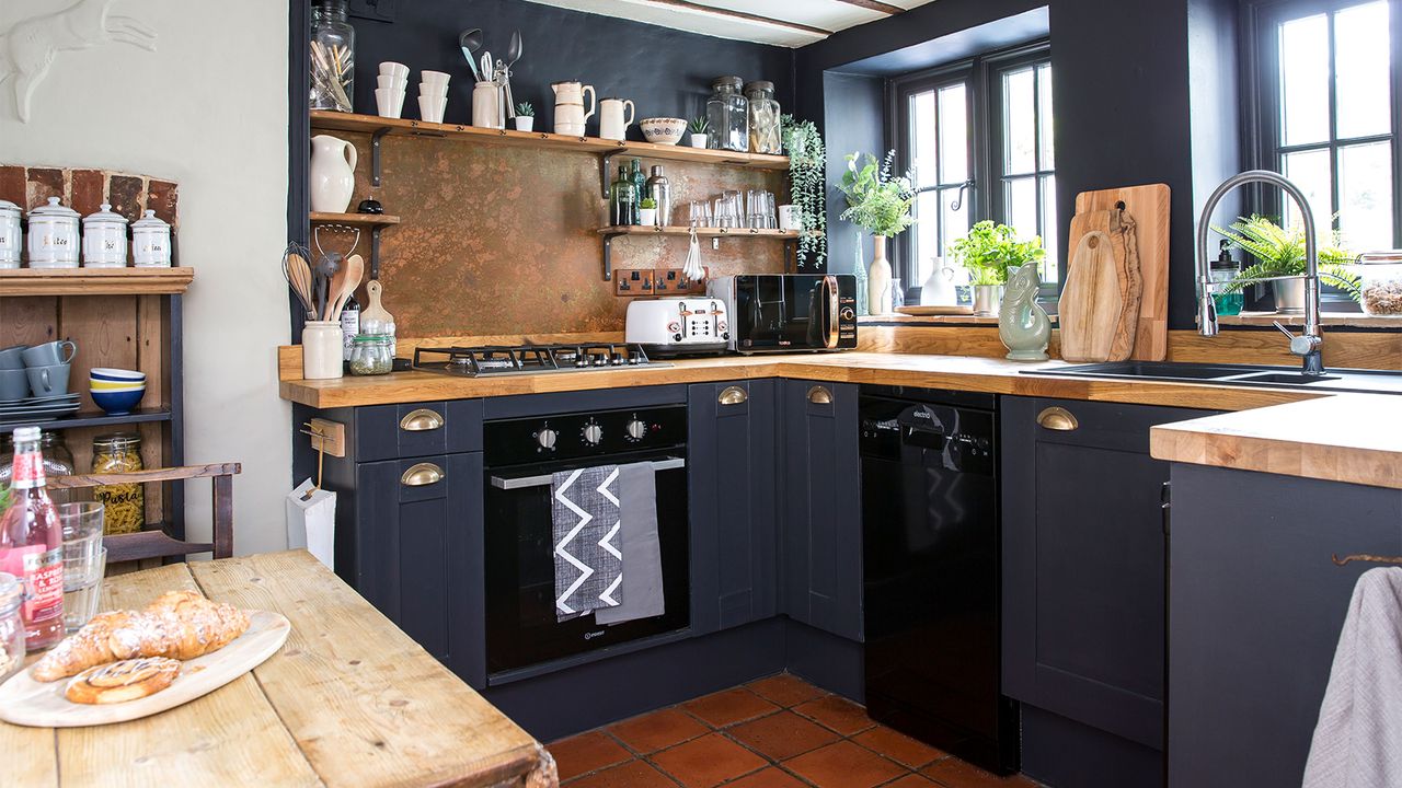 black painted kitchen with wooden worktops