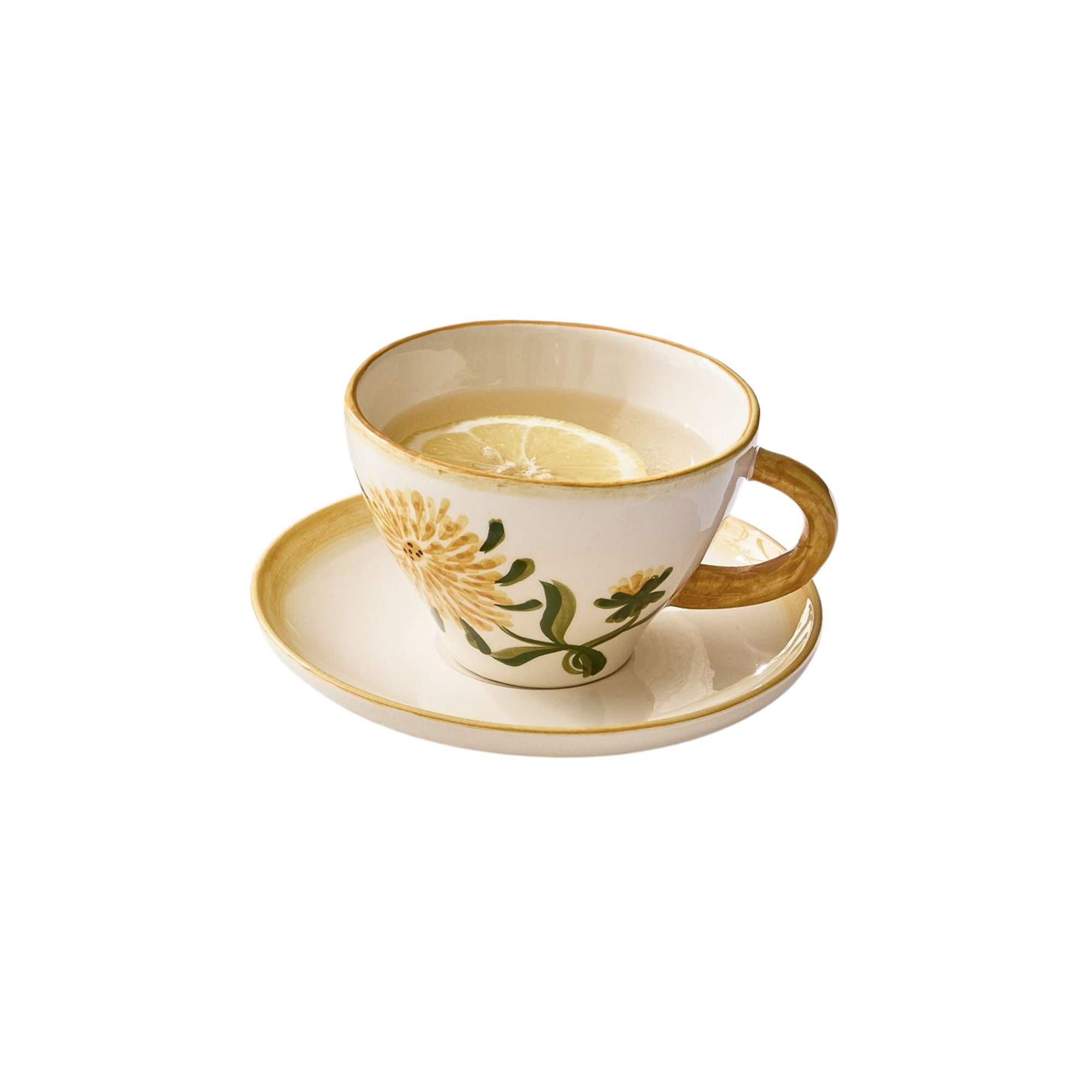a yellow floral tea cup