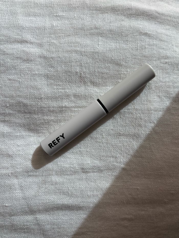 The xx brow gel on a white linen background
