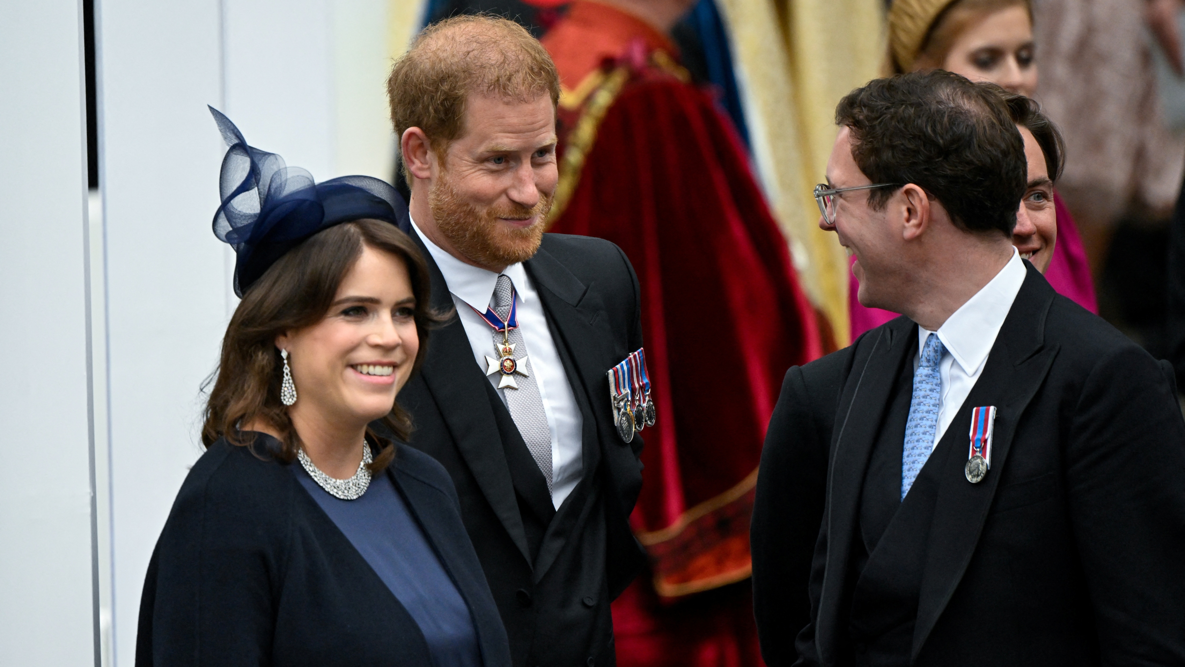 Prince Harry, Princess Eugenie and her husband Jack Brooksbank leave Westminster Abbey following the Coronation of King Charles III and Queen Camilla on May 6, 2023