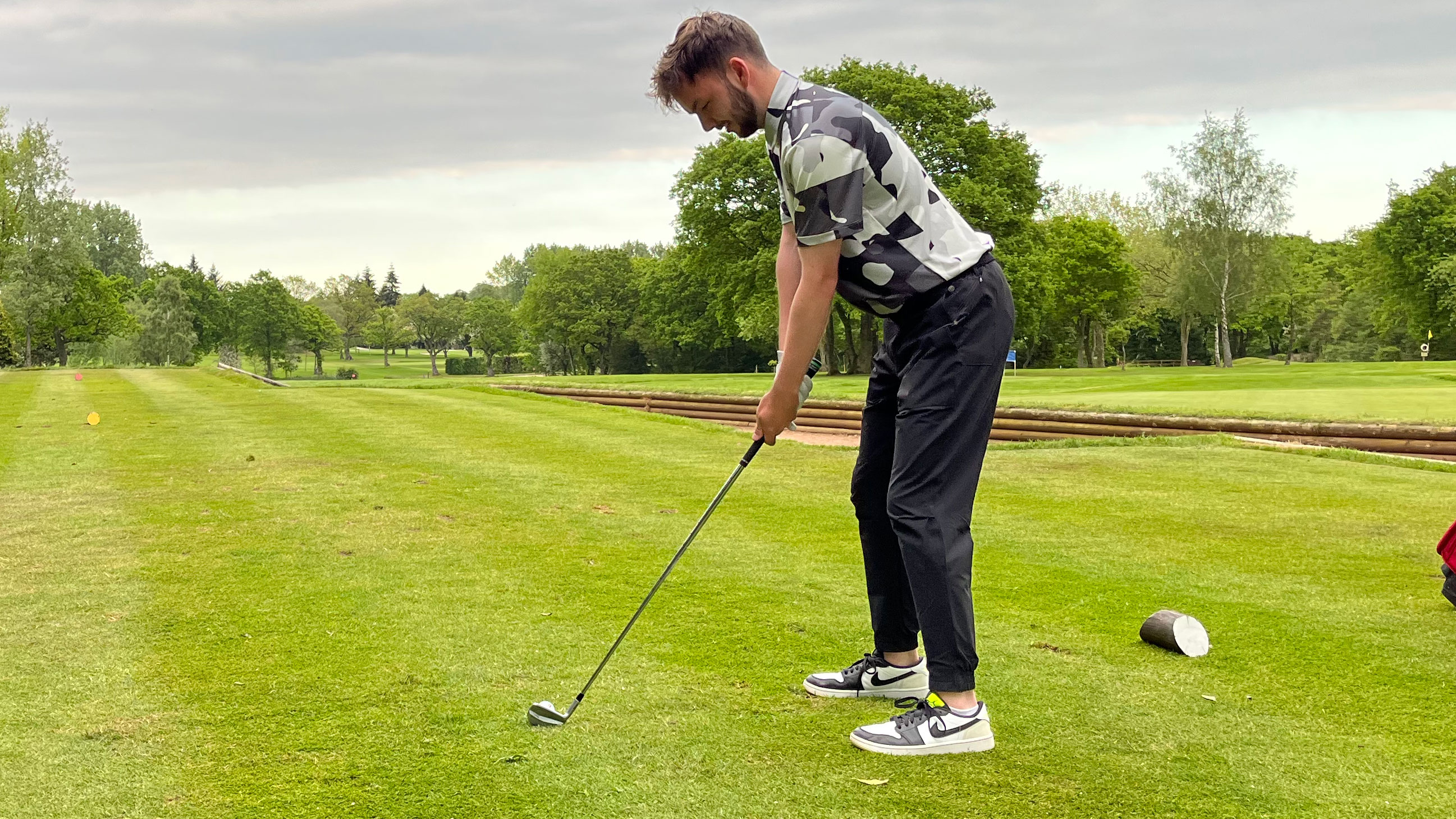 Dan Parker on course testing the Nike Air Jordan Low 1 G golf shoes