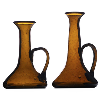 two brown glass candlesticks in a hand-formed lantern shape
