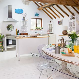 kitchen room with white walls and wooden flooring