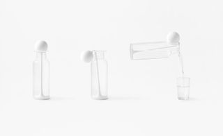 Press lid – a lid for a liquid container that opens like a mouth when pressing down its top by Nendo
