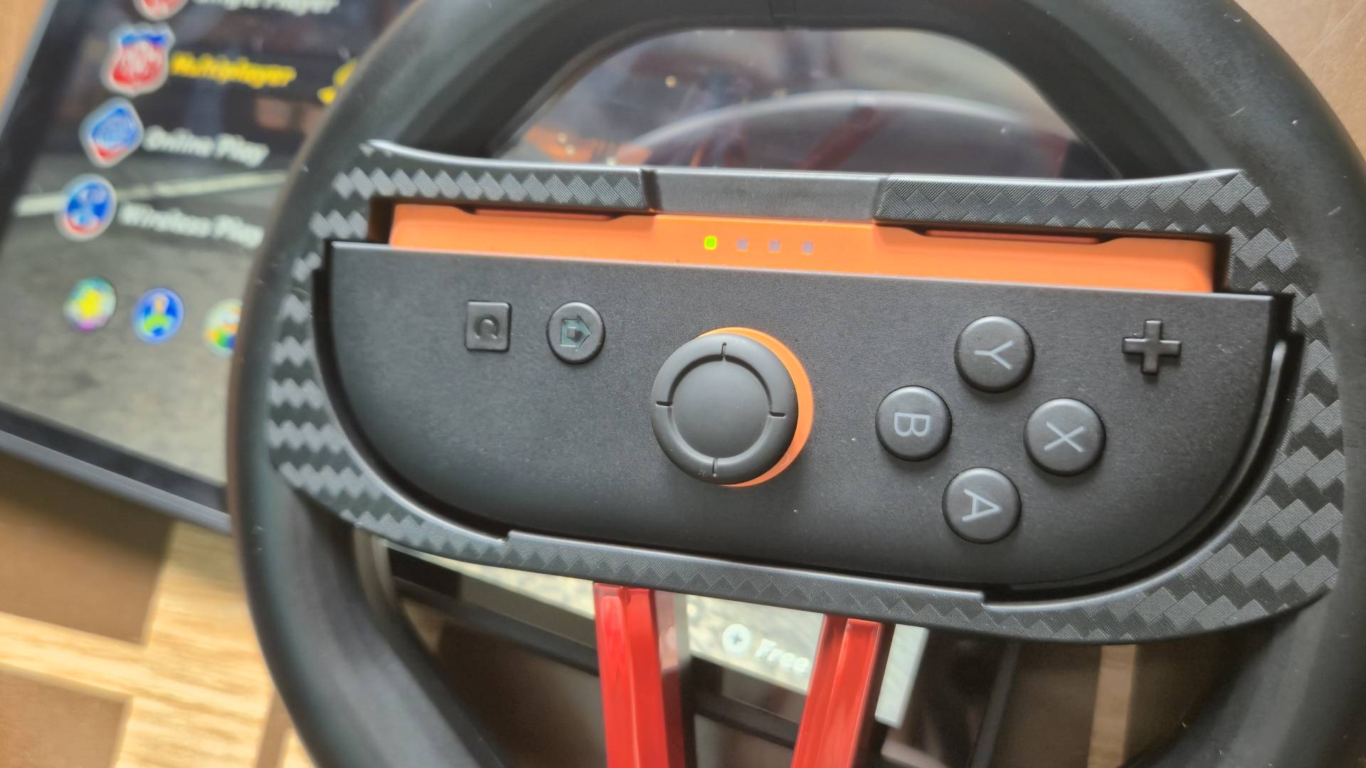 Photo by Rosalie Newcombe of the 4gamer (STEALTH) Switch 2 Twin Racing Wheel controllers sitting on a wooden coffee table.