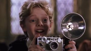 Colin Creevey holding his camera in Harry Potter and the Chamber of Secrets