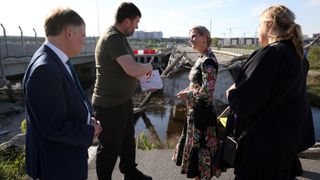 Sophie, Duchess of Edinburgh and the Ambassador of the United Kingdom to Ukraine Martin Harris (L) visit the Romanivska Bridge on April 29, 2024 in Irpin, Ukraine