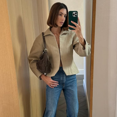 woman wearing tan jacket jeans fall outfit 2025