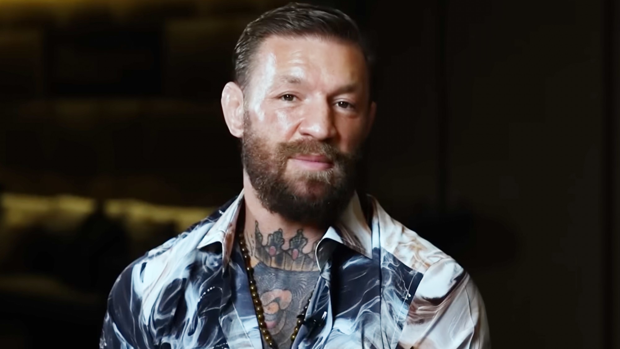 Conor McGregor smiling for the camera.