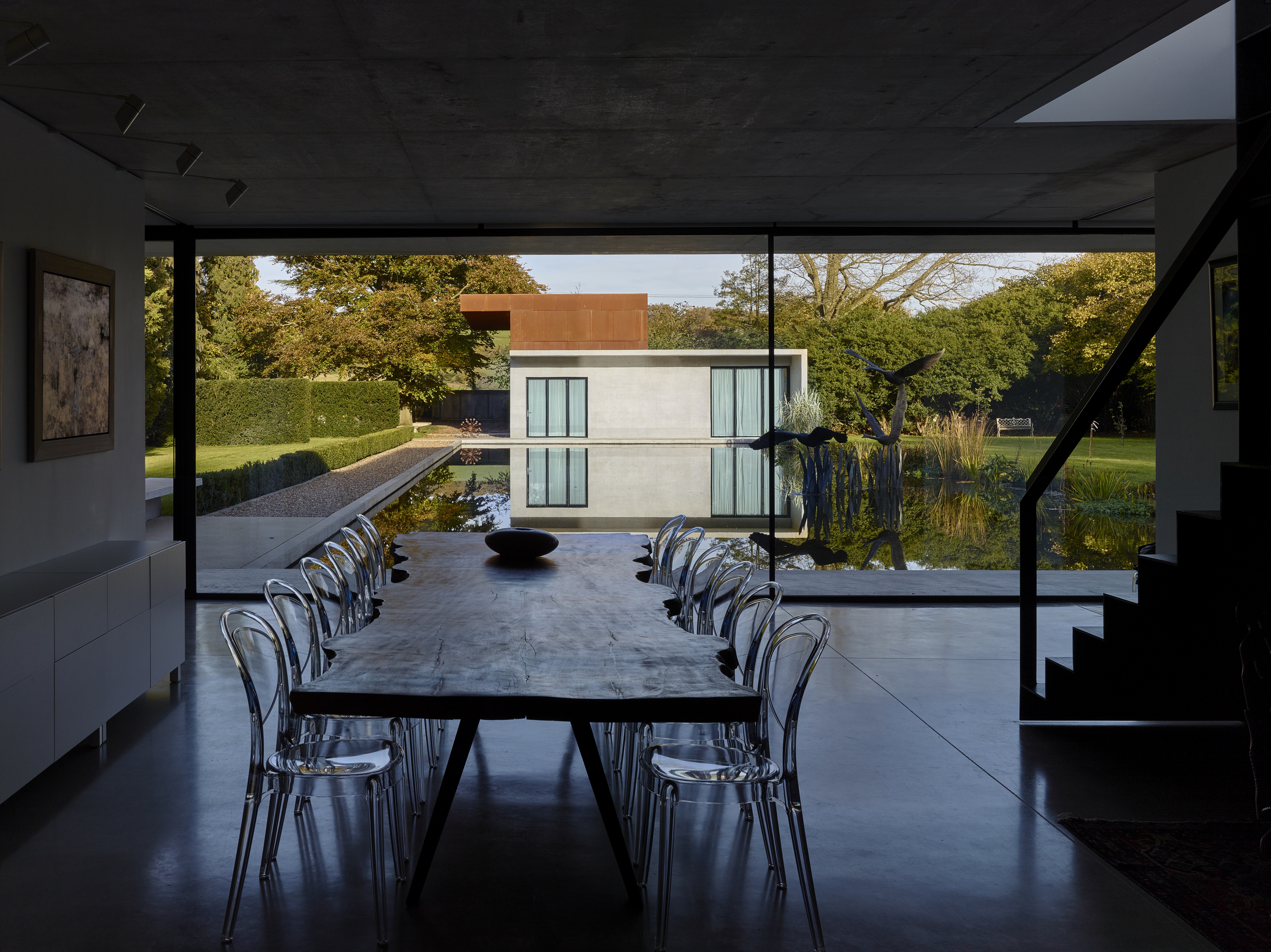 Dining room looking through full-height windows to the garden