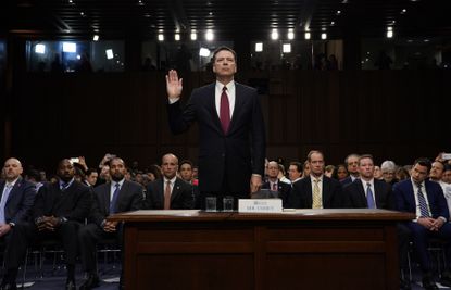 James Comey swears in.