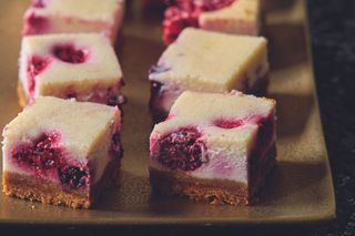 berry cheesecake bites on a platter