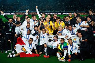 YOKOHAMA, JAPAN - DECEMBER 16: The Corinthians squad celebrate after winning the FIFA Club World Cup Final Match between Corinthians and Chelsea at International Stadium Yokohama on December 16, 2012 in Yokohama, Japan. (Photo by Lintao Zhang/Getty Images)