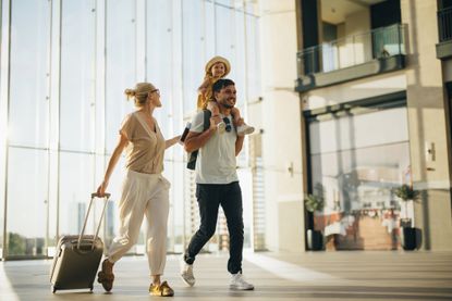 Family going on holiday at the airport towards their flights