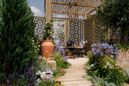 garden design pergola with mediterranean planting and a meandering path