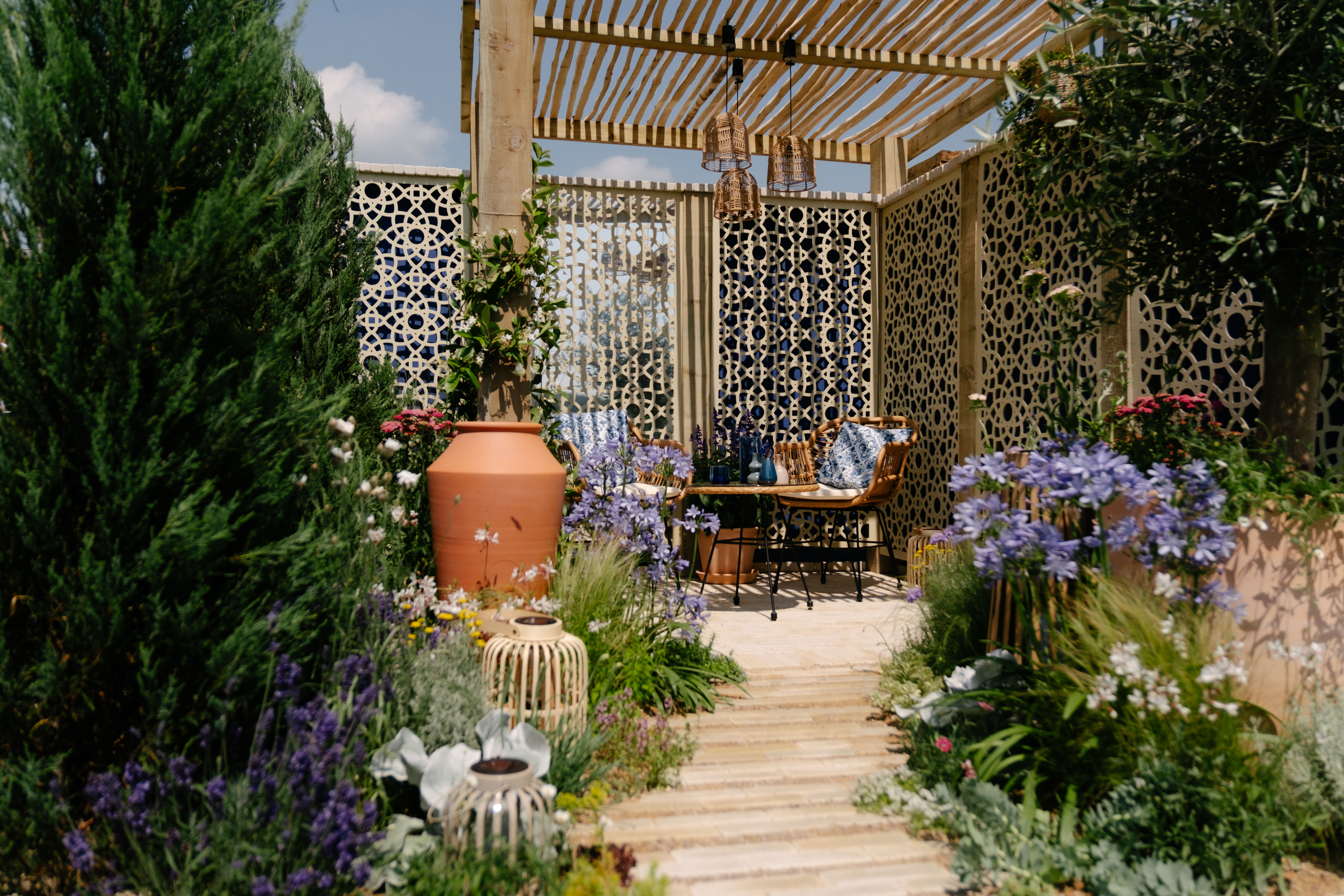 garden design pergola with mediterranean planting and a meandering path
