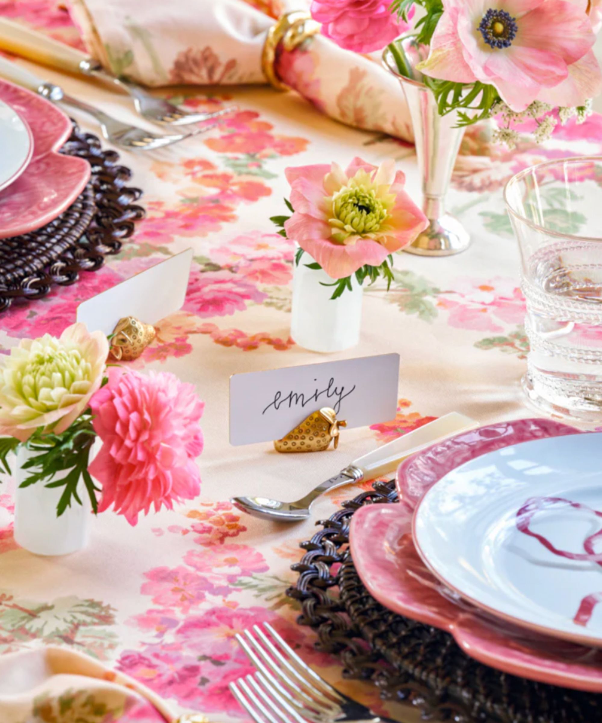 gold strawberry placecard holder on pink themed table setting