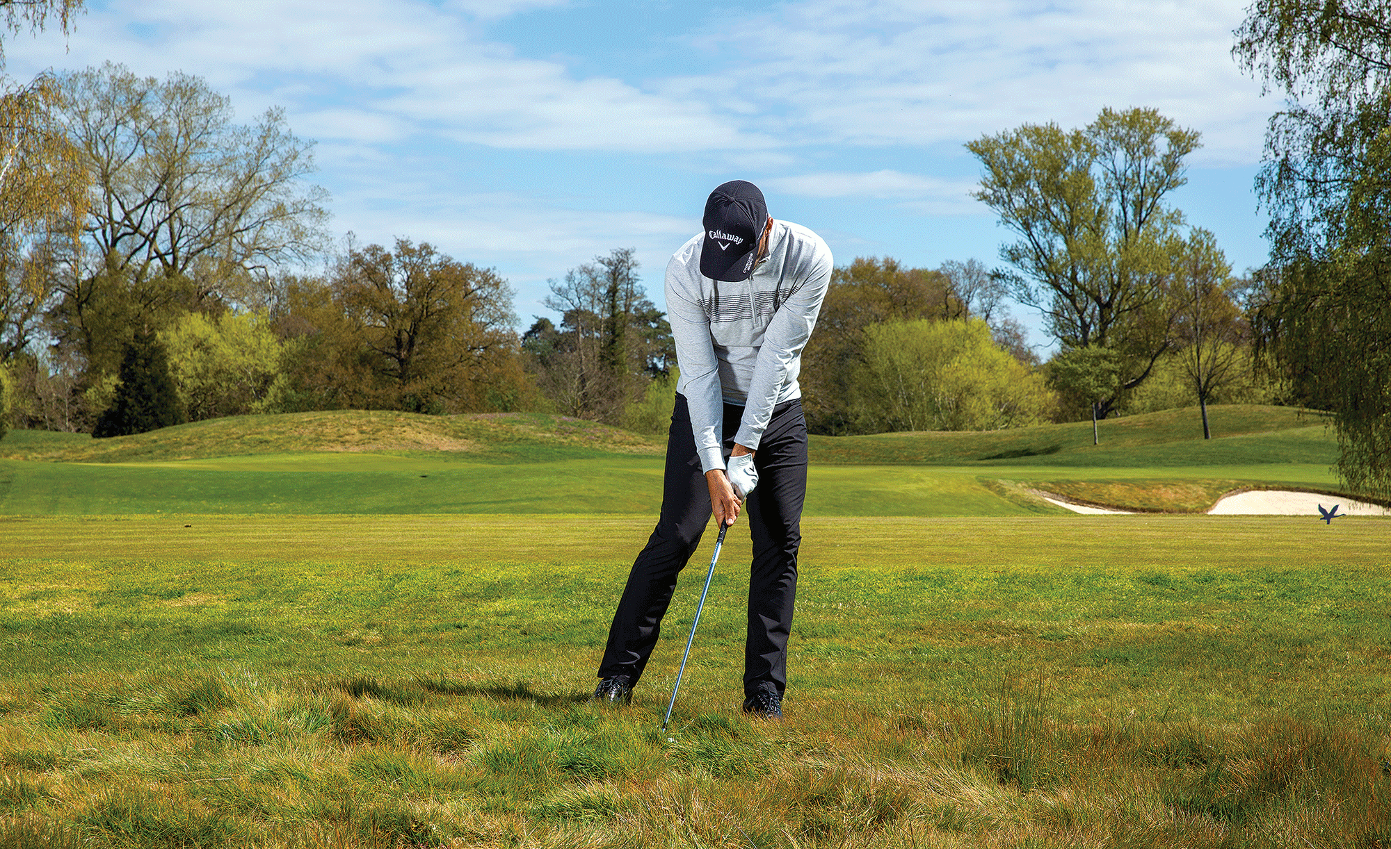 Zane Scotland demonstrating more shaft lean and a steeper angle of attack when hitting iron shots from the rough