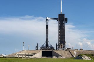 A SpaceX Falcon 9 rocket topped with a Dragon cargo capsule sits on the pad at NASA's Kennedy Space Center in Florida on July 12, 2022