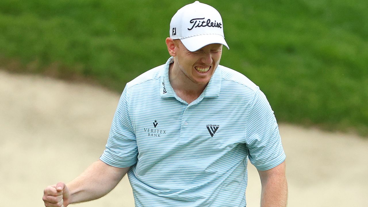 Hayden Springer of the United States reacts after a birdie putt on the 18th hole for a score of 59 in the first round of the John Deere Classic at TPC Deere Run on July 04, 2024 in Silvis, Illinois.