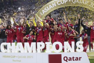 Qatar players celebrate after beating Jordan to win the 2023 Asian Cup in February 2024.