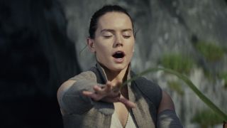 Rey being tickled by a leaf in The Last Jedi