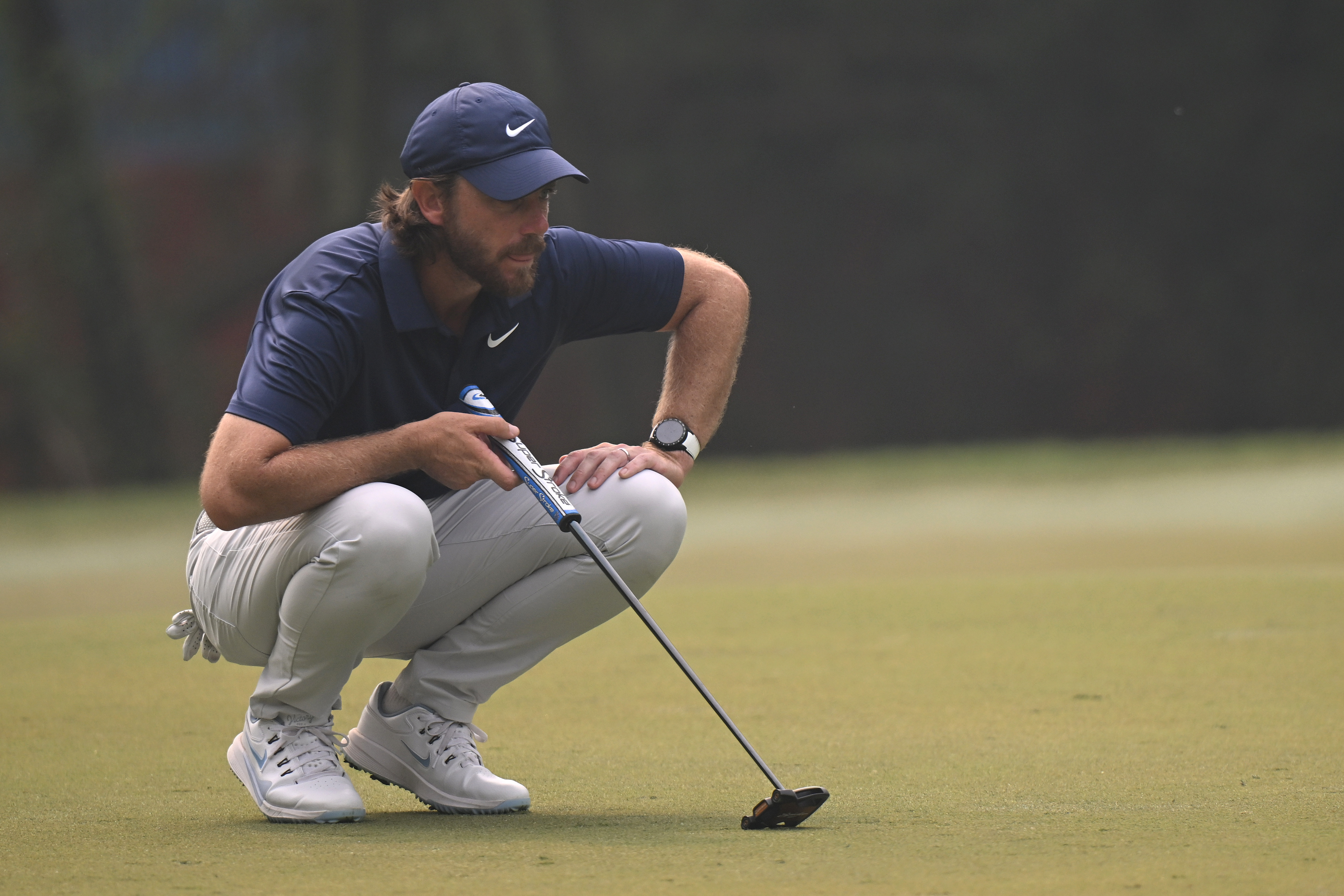Tommy Fleetwood lines up a putt