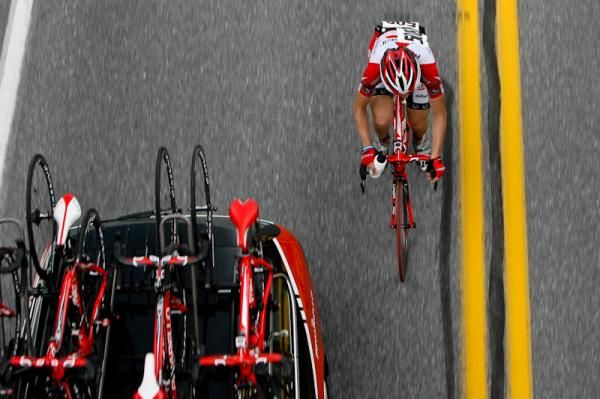 A Bissell rider rolls up to the team car for service.