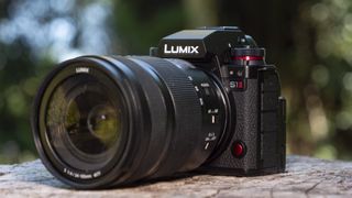 Panasonic Lumix S1 II mirrorless camera outdoors on a wooden surface