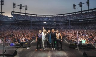 Def Leppard take a bow onstage in Detroit