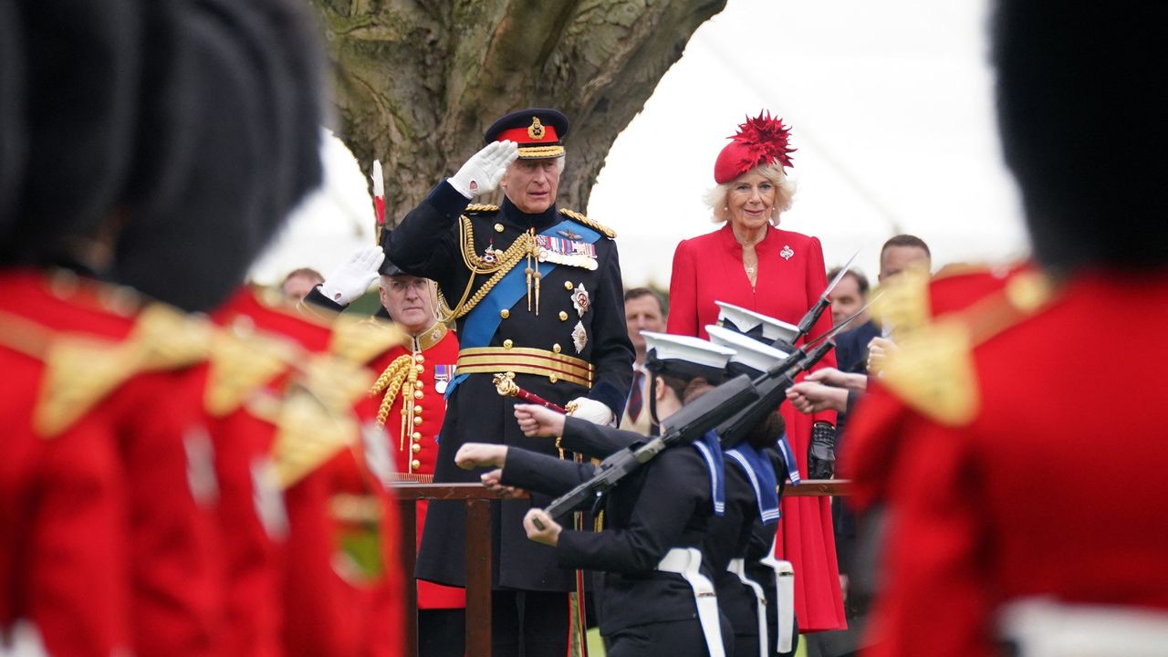 King Charles saluting armed forces 