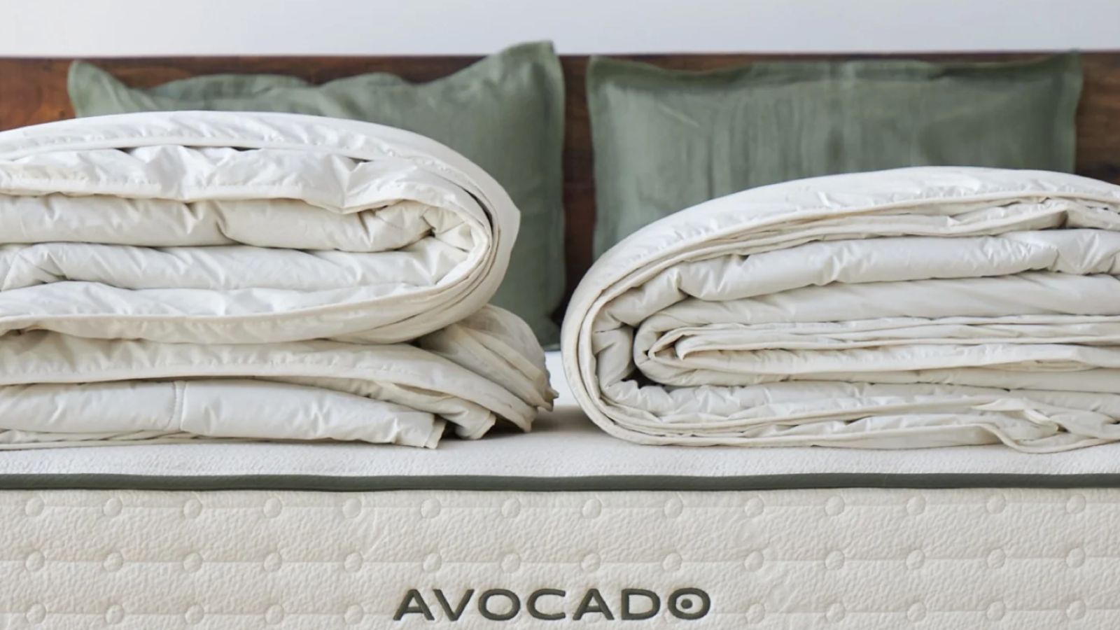 Two folded duvet inserts on an Avocado mattress