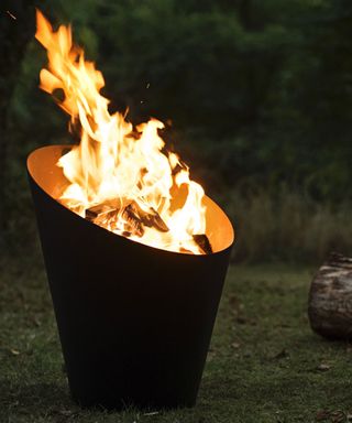metal fire pit with flames