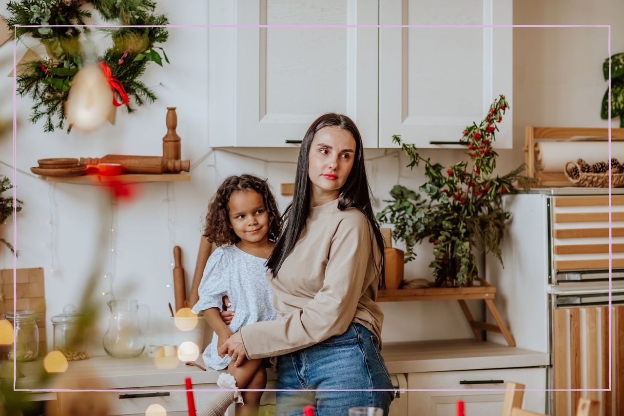 stock image of Parent with the guilt feeling look with child at Christmas