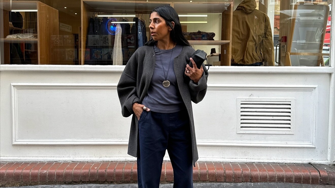 Woman wears Leset elastic waistband pants, Asics sneakers and St. Agni Studio top. 