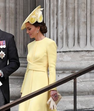 Kate Middleton wearing a yellow flower hat in 2022