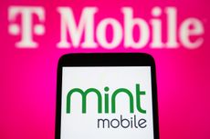 A smartphone with the Mint Mobile logo in front of a T-Mobile logo.